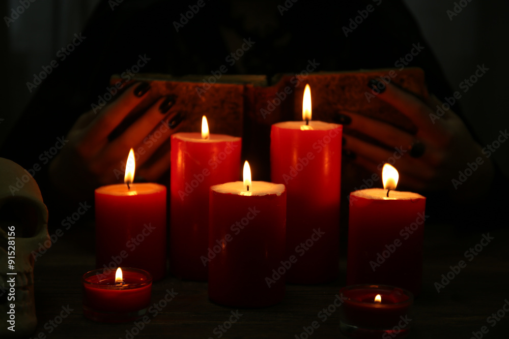 Witch - fortune teller with candles close up