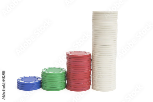 4 stacks lots of casino chips on white with clipping path