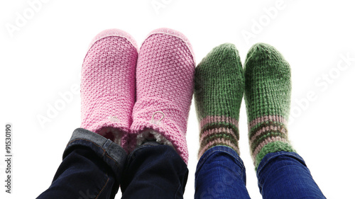 Human feet in knitted socks isolated on white