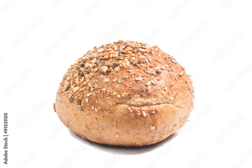 Fresh whole grain bread cut in half on white background
