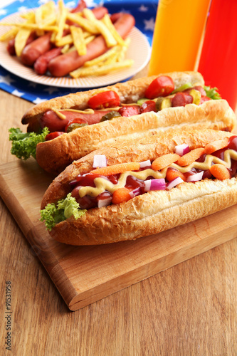 Fresh hot dogs on wooden background