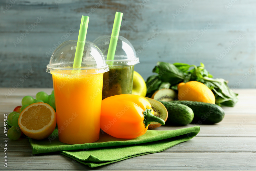 Fresh juice mix fruit, healthy drinks on wooden table, on bright background Fresh juice mix fruit, healthy drinks on wooden table, on bright background