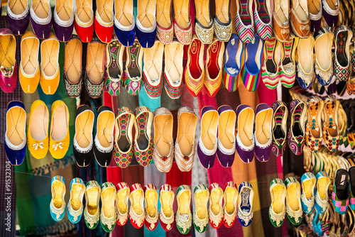 Colorful ethnic shoes on flea market in India