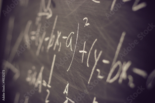 Maths formulas on chalkboard background photo