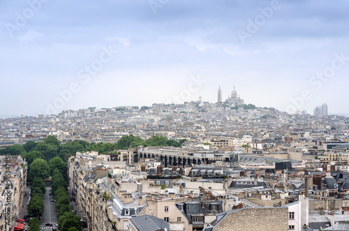 Basilica Sacre Coeur in montmartre with paris skyline