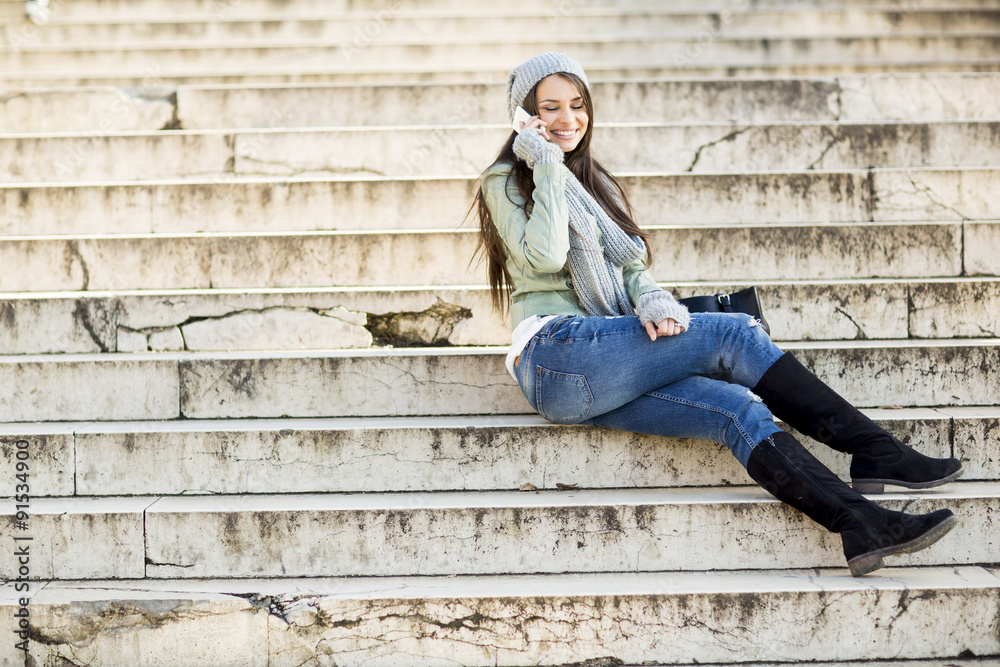 Young woman sitting on the stairs outdoor Young woman sitting on the stairs outdoor
