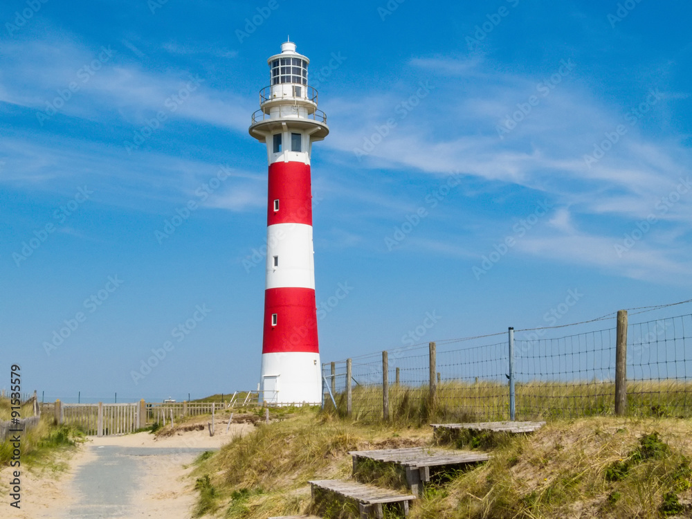 Red-white lighthouse on the coast of the North Sea