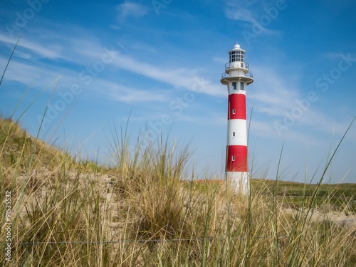Red-white lighthouse in a sunny day