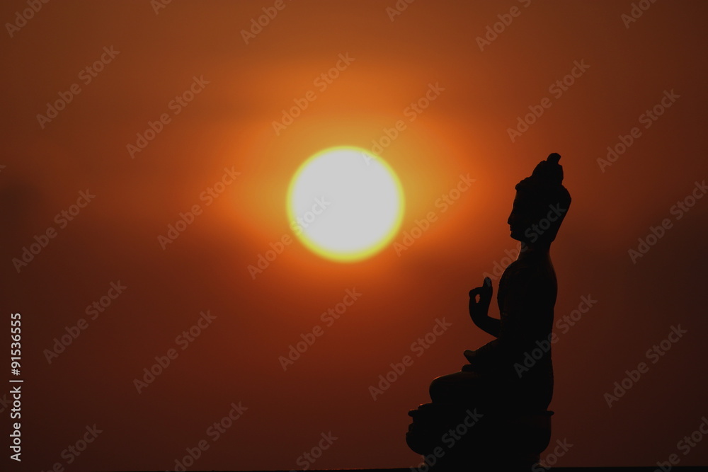 lord Buddha silhouette at sunset
