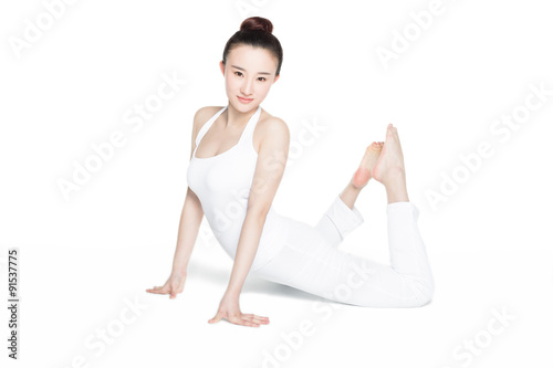 smiling sporty girl doing yoga practice © xin wang