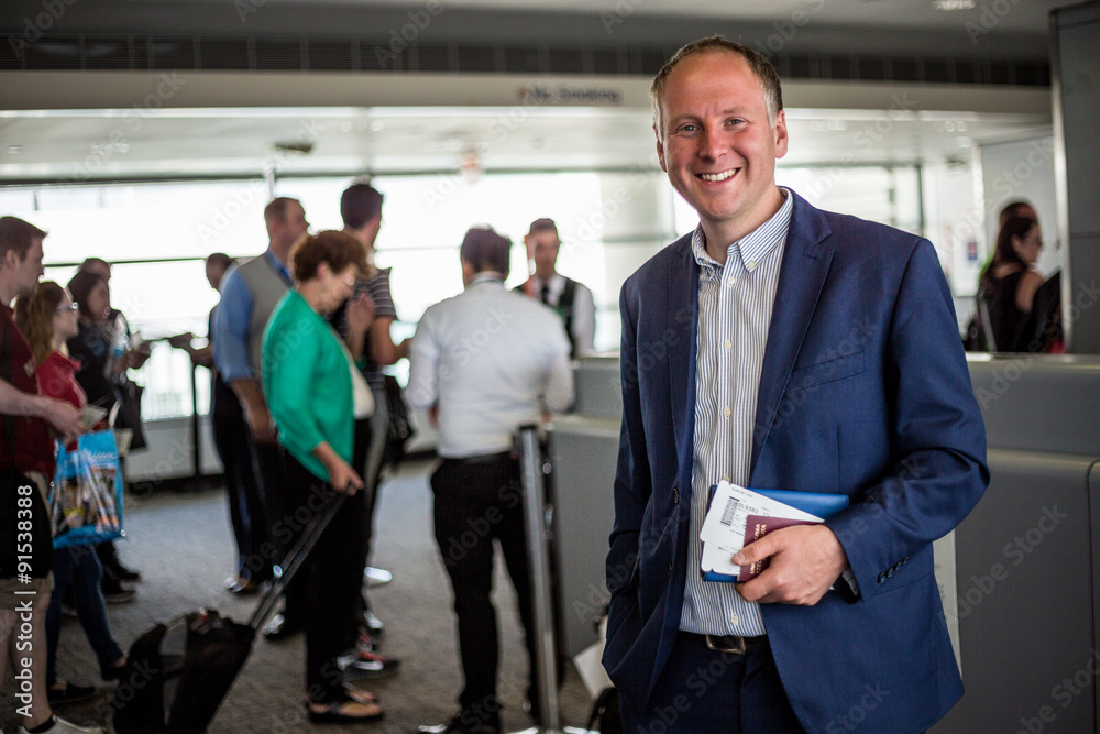 Businessman with passport and boarding pass at the airport Businessman with passport and boarding pass at the airport