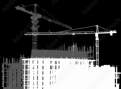 white and gray two cranes above unfinished buildings
