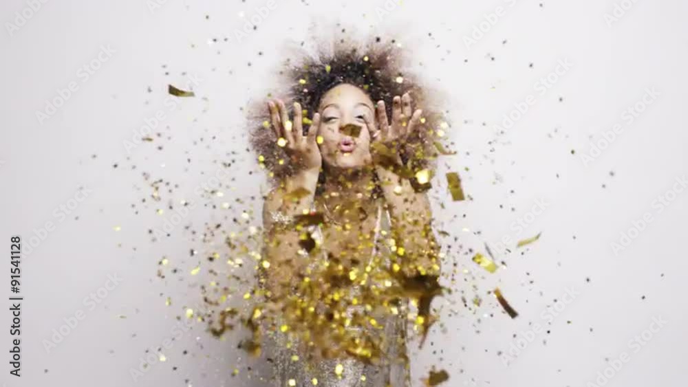 Beautiful hispanic woman blowing gold glitter confetti slow motion  - Red Epic Dragon