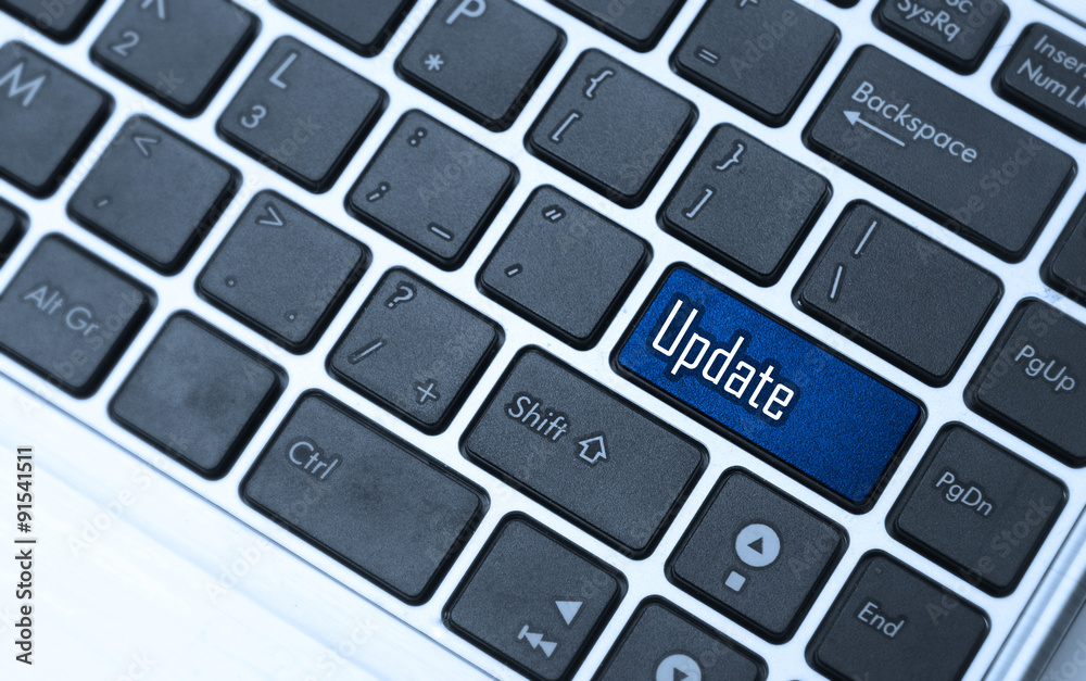 Computer notebook keyboard with Update key - technology backgrou Computer notebook keyboard with Update key - technology backgrou