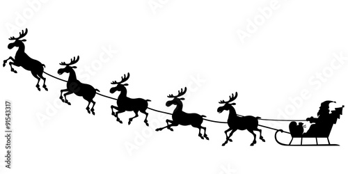 Silhouette Santa riding on reindeer sleigh