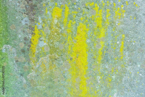 Concrete wall background with splashing green and yellow colour © kityyaya