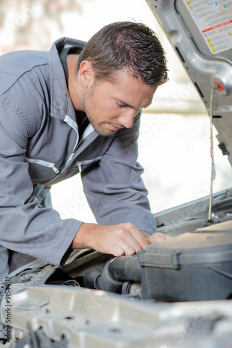 Mechanic repairing an engine