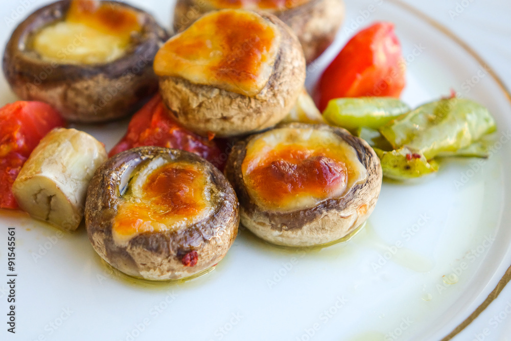 Mushrooms baked with cheddar cheese. Mushrooms baked with cheddar cheese.