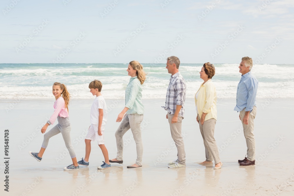 Multi generation family standing beside one another Multi generation family standing beside one another