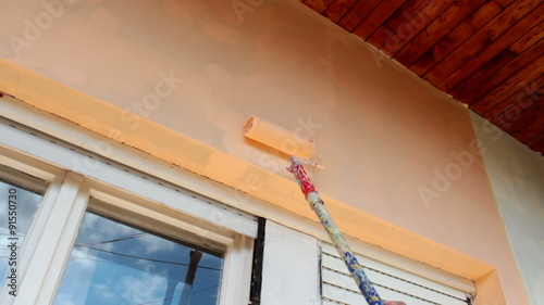 Painter whitewashed facade of a house, Video clip