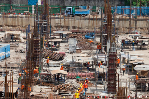 construction site and worker at dusk in Thai.