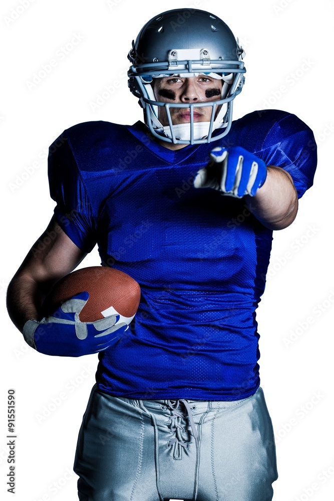 Portrait of American football player in uniform pointing Portrait of American football player in uniform pointing