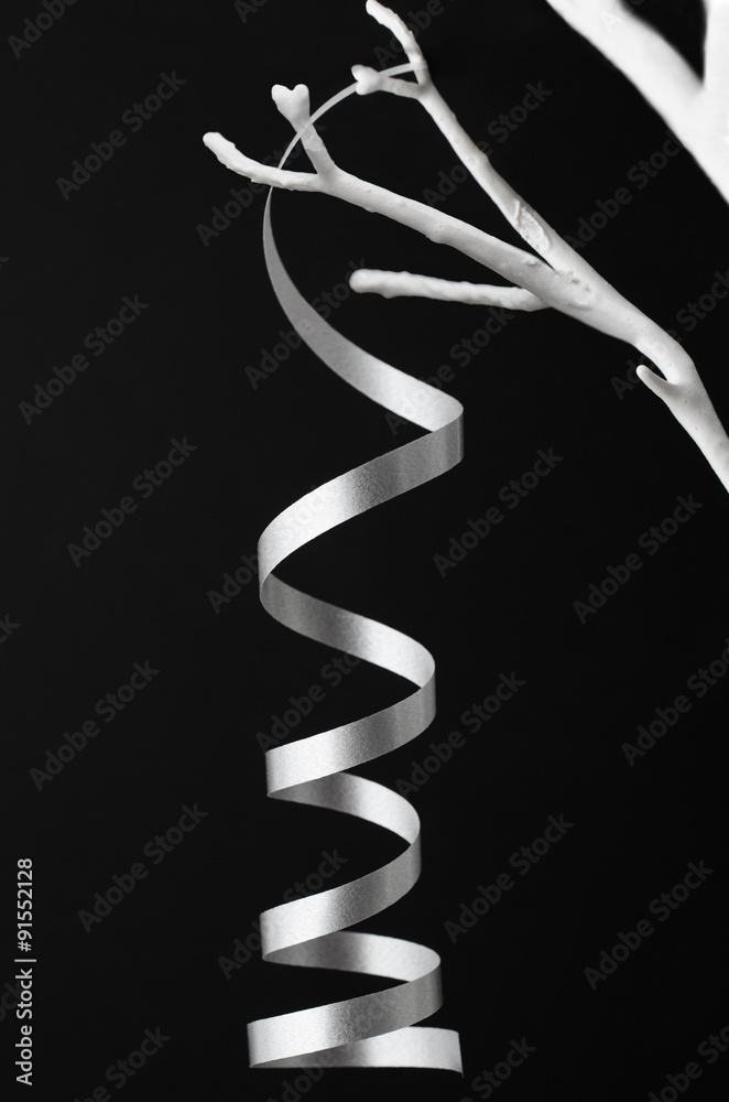 Silver Christmas Curling Ribbon Hanging from White Tree Branches Silver Christmas Curling Ribbon Hanging from White Tree Branches