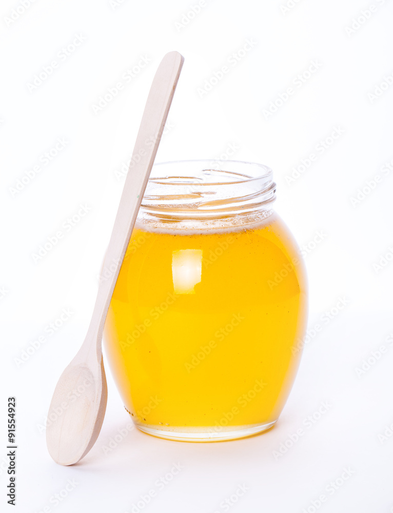 Glass jar full of honey on a white background. food, medicine