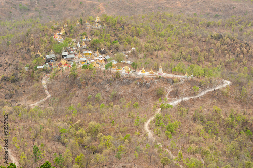 Golden pagodas is on Sagaing Hill, Myamar. View frm the top of t photo