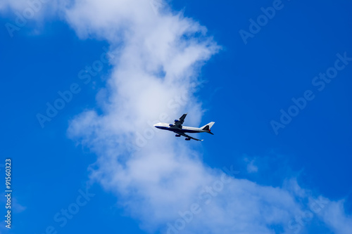 Passenger Airplane flying into the clouds over Windsor Castle  UK