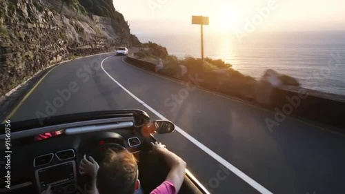 Couple driving convertible car cabriolet cape town south africa steadicam shot