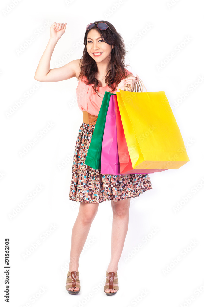 Happy shopping woman with bags white backboard.