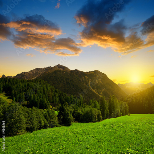 Alpine landscape with mountain range at sunset .Switzerland © vencav