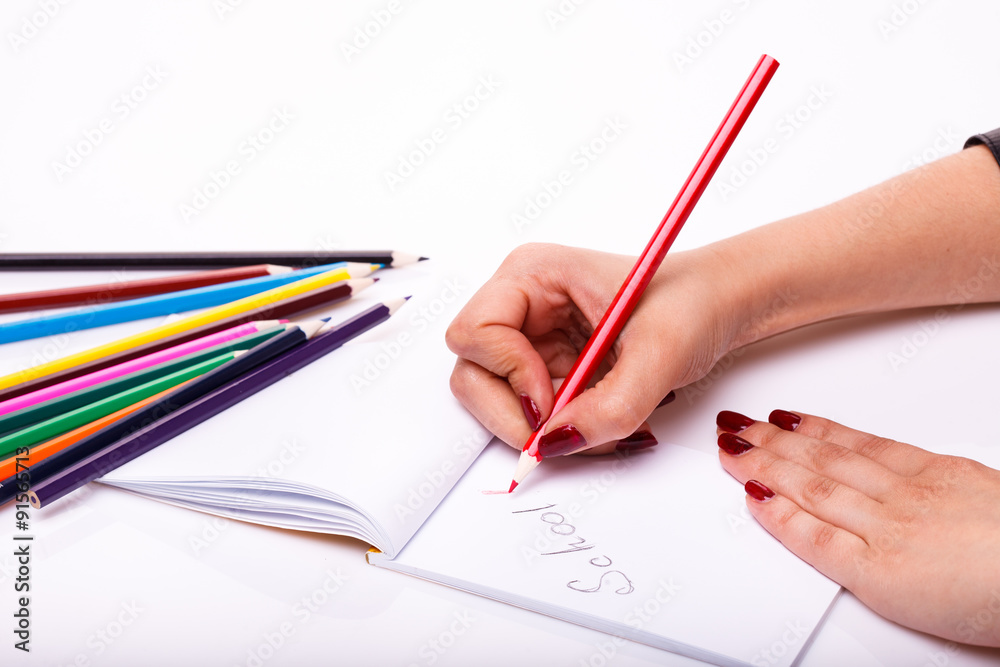 Hand and pencils