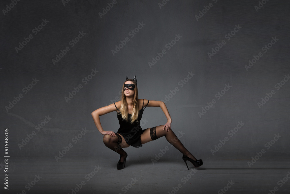model with mask squat pose