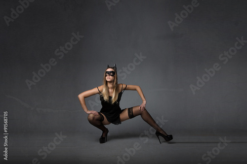 model with mask squat pose