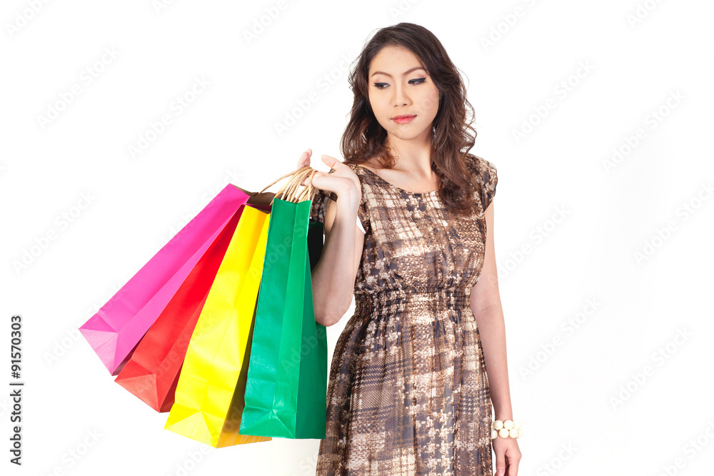 Woman with shopping bags on white background.