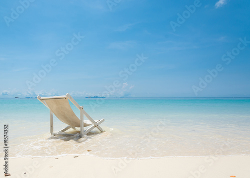Slika na platnu beach chair on beach with blue sky