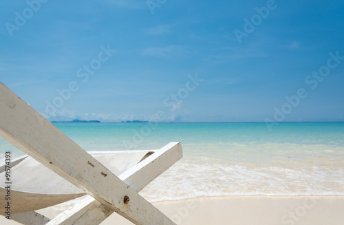 beach chair on beach with blue sky