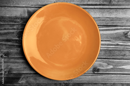 Orange plate on table