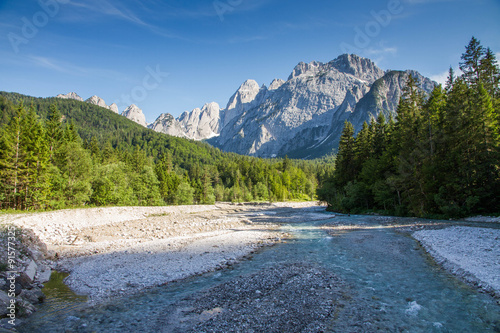 Valley in the Alps with a river and mountains