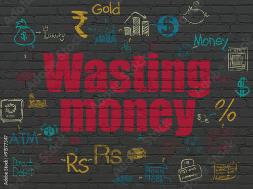 Money concept: Wasting Money on wall background