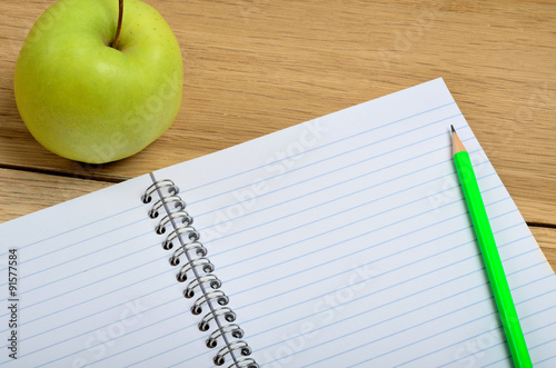 Blank notebook with apple fruit