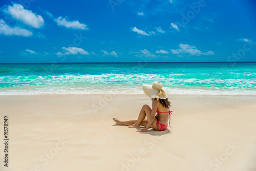 Happy girl at  Beautiful beach on island Mahé in Seychelles - Anse Intendance 