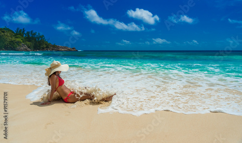 Fototapeta Naklejka Na Ścianę i Meble -  Happy girl at  Beautiful beach on island Mahé in Seychelles - Anse Intendance 
