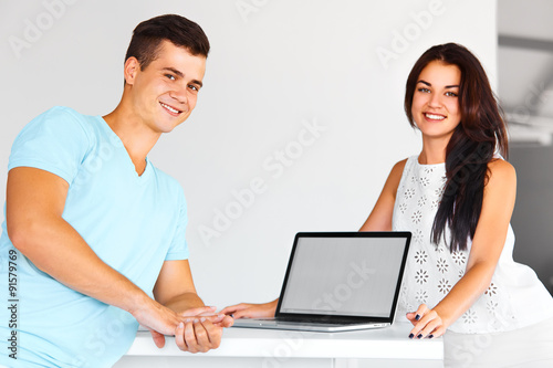 Man and woman smiling at the camera. Concept of start up and beg