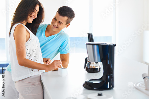 Woman making coffee for her husband Fototapete