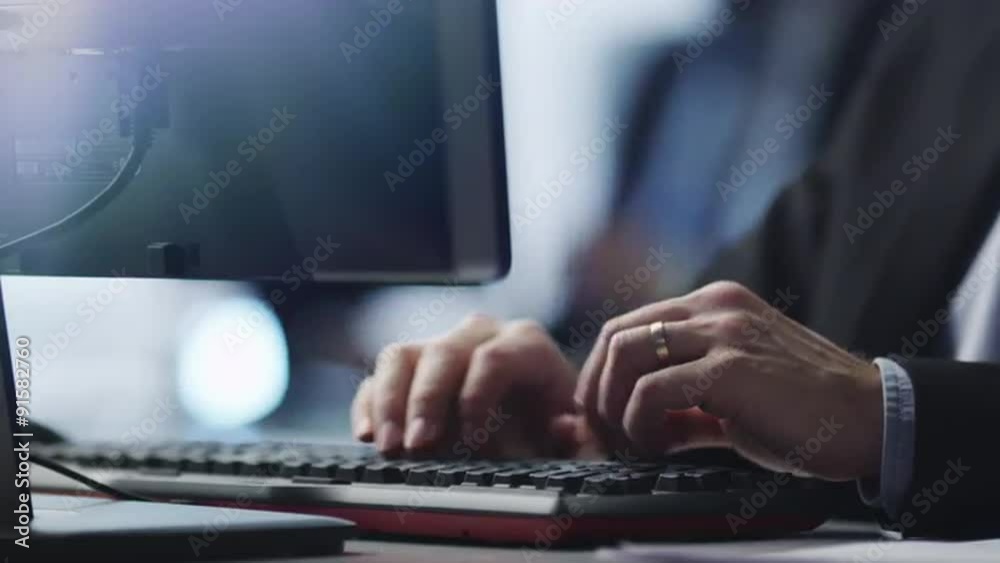 Office Worker is Typing on Keyboard.
Shot on RED Cinema Camera in 4K (UHD). Its easy scale, rotate and crop without loosing quality.