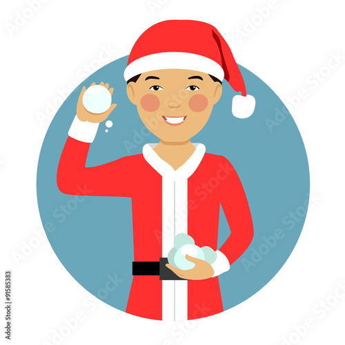 Asian boy holding snowballs