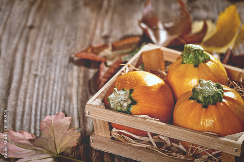 Autumn decoration with leaves and pumpkins